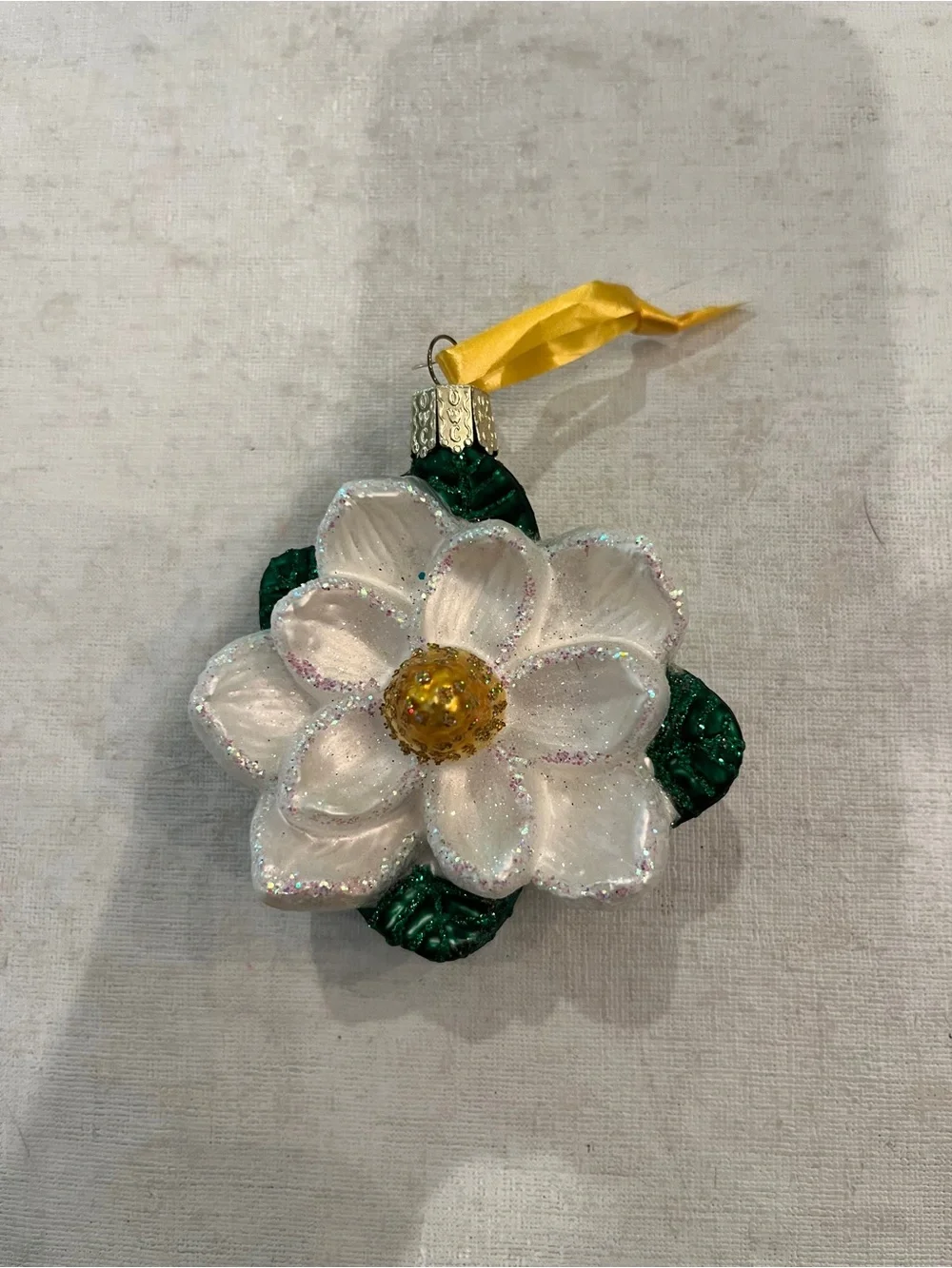 Old World Christmas White & Green Magnolia Flower glitter Glass Ornament. GUC!